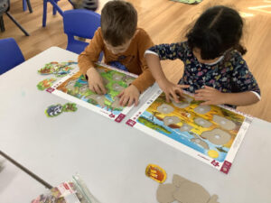 Hands-on learning through puzzle-solving at one of the best early learning center for young minds.